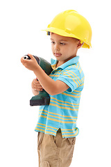 Image showing Child, construction worker and play development or hat for handyman, safety or drill. Boy, diy costume and studio white background as mockup space for future ambition for kid fun, engineer or build