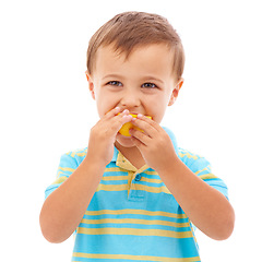 Image showing Child, eating and portrait with lemon or fruit in white background, studio and mockup space. Sour, slice and kid with healthy food, nutrition and citrus in diet for wellness and vitamin c benefits