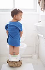 Image showing Boy kid, potty training and bathroom with thinking, diaper and pants on floor for learning, development and progress. Child, family home and back in toilet with ideas, hygiene or solution with nappy