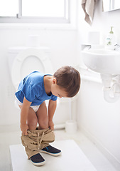 Image showing Child, bathroom and toilet training in diaper or learning growth, milestone or hygiene. Male person, kid and pants or step for development in home for parent care for toddler teaching, health or love