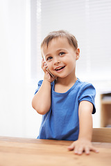 Image showing Toddler, boy and phonecall at home, playing and communication with technology. Happiness, calling and conversation for learning, cellphone and excited for child development, mobile and digital