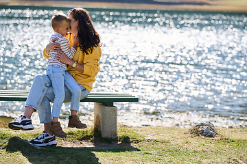 Image showing A mother and son create cherished memories as they playfully engage in outdoor activities, their laughter echoing the joy of shared moments and the bond between parent and child