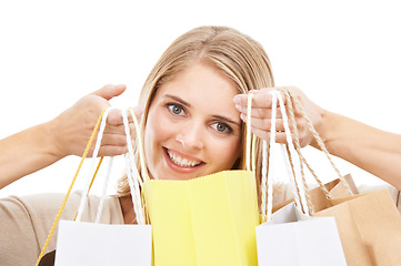 Image showing Portrait, woman and shopping bag in studio for retail sales, financial freedom or commerce savings from market white background. Face of happy customer with gift bags for deal, discount and promotion