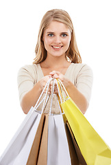 Image showing Portrait, happy woman and shopping bag in studio for retail sales, financial freedom or commerce savings from market white background. Wealthy customer giving gift bags of deal, discount or promotion