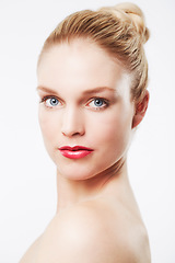 Image showing Portrait, confidence and model in studio with red lipstick, cosmetics and beauty by white background. Woman, pride or aesthetic for glow face in make up or blonde hair on skincare for body positivity