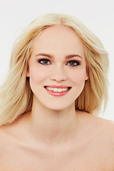 Image showing Cosmetic, makeup and happy portrait of woman with beauty in white background of studio. Blonde, model and smile on face for skincare, dermatology or hair care from salon or spa in mock up space