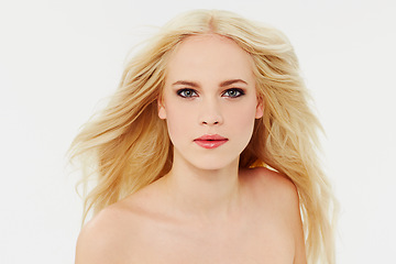 Image showing Cosmetics, makeup and portrait of woman with beauty in white background of studio. Blonde, model and smooth face with facial skincare, dermatology or hair care from salon or spa mock up space