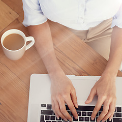 Image showing Hands, business person and coffee at laptop for typing email, planning online research and editing from above. Closeup, mug of tea and employee working on computer keyboard for digital administration