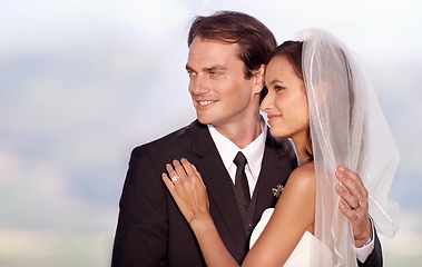 Image showing Couple, love and hug on wedding day in outdoors, trust and commitment for marriage or relationship. Happy people, embrace and smiling in outdoor ceremony, partnership and celebrating vow or bonding