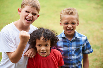 Image showing Boys, friends and portrait or happy on grass in summer with confidence, pride or diversity in nature. Kids, face and smile outdoor with play for friendship, care and support on playground or field