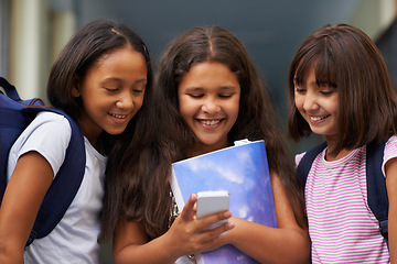 Image showing Elementary school, friends and happy girls with phone for social media, digital education or download elearning tech. Diversity, young students or kids typing on mobile for studying, knowledge or app