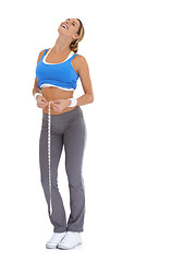 Image showing Fitness, measuring tape and portrait of woman in a studio for exercise, training or workout. Sports, laugh and young happy female person with equipment for weight loss isolated by white background.