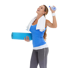 Image showing Yoga mat, sports and young woman in studio for health, body or pilates workout. Fitness, towel and happy female person with equipment and water for exercise or training isolated by white background.
