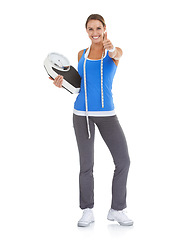 Image showing Woman thumbs up, fitness scale and measure tape in studio for weight loss, health goals and like, ok or yes. Portrait of happy model with workout results, success and feedback on a white background