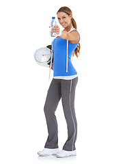 Image showing Woman, water bottle and scale for health, nutrition and diet with exercise, workout or results in studio. Portrait of model with measure tape and liquid or offer for training on a white background