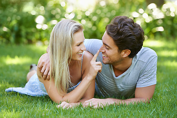 Image showing Couple, relax in park and smile with love and commitment in healthy relationship. People on grass on date outdoor, nose touch and care with trust, partner and bond together for marriage and romance