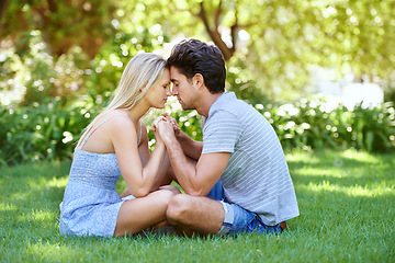 Image showing Couple, forehead touch and relax in park with love and commitment in healthy relationship. People on a date outdoor, peace and mindfulness with trust, partner and bonding together for marriage