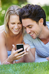 Image showing Grass, phone or happy couple on social media in nature to relax together on outdoor holiday vacation. Smile, woman or man with funny meme or online post for bond with love, support or care on field
