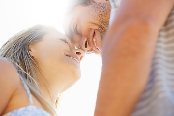 Image showing Forehead, eye contact or happy couple hug in outdoor on date for support or love in nature together. Low angle, romantic man or woman with smile on holiday vacation for fun bond, travel or wellness