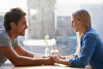 Image showing Holding hands, cafe or happy couple on date talking or speaking of anniversary or holiday vacation. Tea drink, woman or romantic man in conversation for care, love or support to relax in coffee shop