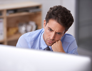 Image showing Business man in office, thinking and productivity, lawyer busy with case research, review and analysis. Professional, workflow and reading on computer with attorney in workplace, expert and solution