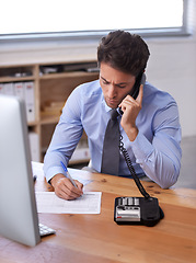Image showing Business man, phone call and writing notes on landline in workplace, contact and consulting in office. Male professional, planning and communication or discussion, technology and connection for info