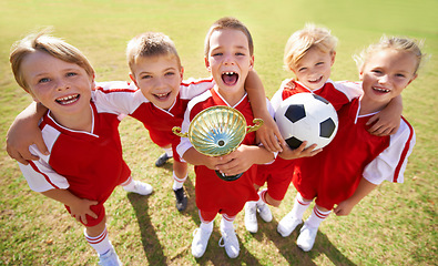 Image showing Kids, soccer team and portrait with cup, boys and girls with victory, support or solidarity. Achievement, sports and friendship, together and happy for win, ready for game or physical activity