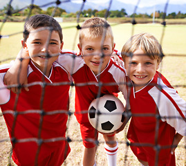 Image showing Kids, soccer team and portrait with smile, goal net and boys with teamwork, support or solidarity. Energy, sports and friendship, together and happy for win, ready for game and physical activity