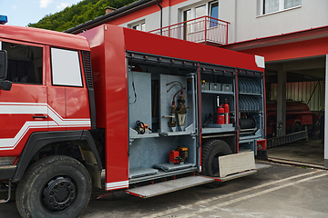 Image showing Close-up of essential firefighting equipment on a modern firetruck, showcasing tools and gear ready for emergency response to hazardous fire situations