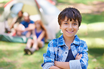 Image showing Kid, portrait and smile on camping adventure in outdoors, happy and relaxing on vacation or holiday. Male person, child and face or confident in park, childhood and summer or cheerful in nature