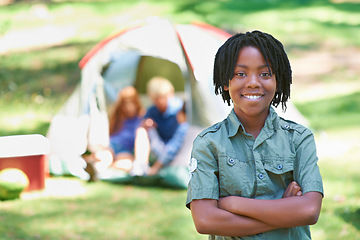 Image showing Child, portrait and happy on adventure at campground, joy and relaxing on vacation or holiday. Black male person, smiling and face or confident in park, childhood and summer or freedom in nature