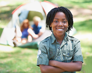 Image showing Child, portrait and smile on adventure at campground, happy and relaxing on vacation or holiday. Black male person, smiling and face or confident in park, childhood and summer or cheerful in nature