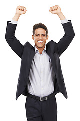 Image showing Business man, arms raised for celebration or bonus at work, professional success and smile in portrait on white background. Happy corporate employee, achievement and cheers with fist pump for winning