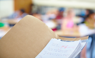 Image showing Classroom, test papers and marks for exams, school and files for students, results and folder. Closeup, academic and education for grading, childhood and person for assignments, scholar and reports