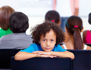 Image showing Portrait, child or boy student in classroom for knowledge, education or development for future growth. Scholarship, back to school or young male kid ready for studying, listening or learning at desk