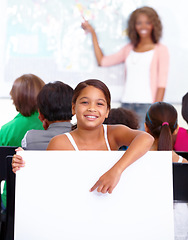 Image showing Woman, portrait and child with poster in classroom for education or learning with teacher at school. Young female person, little girl or kid smile with banner for advertising on mockup space