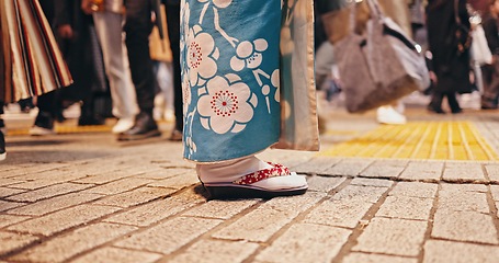 Image showing Japanese woman, feet and city in kimono in sandals, spiritual journey and wellness in heritage by outdoor. Person, waiting or traditional clothes in tokyo on holiday or indigenous fashion in respect