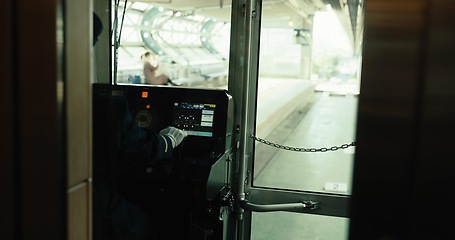 Image showing Subway, driver and cockpit of train in transport, service and control panel in Japan railway cab. Metro, travel and man in cabin with uniform, dashboard and arrive at platform on schedule for journey