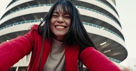 Image showing Selfie, woman and outdoor with a smile, buildings and confidence with urban town, memory and social media. Profile picture, Japanese person and girl with happiness, excited and digital app with joy