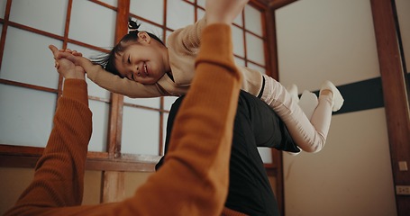 Image showing Parent, home and playing with daughter, happy and smile for joy, japanese and childhood memories. Adult, girl and fun with child, living room floor and parenting together for joy, carefree and care