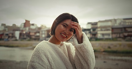 Image showing Woman, japan and portrait with a smile from travel, vacation, and holiday with freedom in a city. Japanese person, journey and laugh on a urban road with adventure in Tokyo with modern fashion