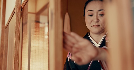 Image showing Japanese, woman and kimono in corridor or tradition in chashitsu room with indigenous fashion or clothing. Person, ritual and ceremony for temae, wellness and zen in architecture building in Tokyo