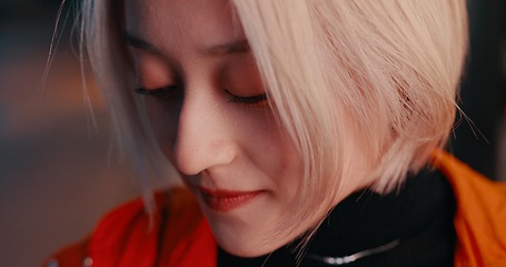 Image showing Japanese woman, closeup and city at night with eyes closed on travel, adventure or journey in Kyoto. Gen z, student and face of girl in dark urban street in town with fashion, style or beauty