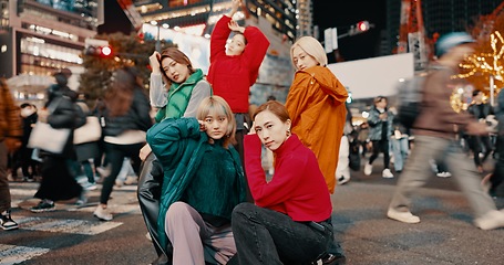 Image showing City, urban fashion and Japanese friends with gen z, youth culture and streetwear style outdoor in Japan with group. Young people, travel and road with teen clothing, women and together in town