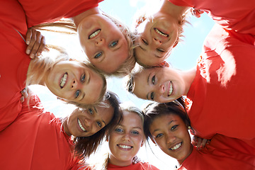 Image showing Team, women and happy with sport huddle for support, celebration or solidarity with blue sky and low angle. Collaboration, athlete and people with smile in circle for fitness, exercise or competition
