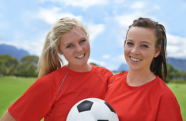 Image showing Happy woman, portrait and friends with soccer ball on green grass for sports, game or outdoor match. Female person or football players smile for fitness, training or practice on open field in nature