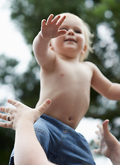 Image showing Baby, mother and playing outdoor for development with nurture, relationship and bonding for happiness. Family, child or toddler and hands with early childhood, parenting and love at park in nature