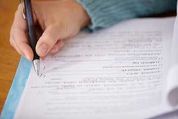 Image showing Hand, pen and teacher mark paper, education and learning with closeup of test or assignment on desk in classroom. Person in class, exam or project, grade and feedback with results, notes and writing