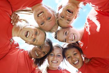 Image showing Team, women and smile with sport huddle for support, celebration or solidarity with blue sky and low angle. Collaboration, athlete and people or happy in circle for fitness, exercise and competition
