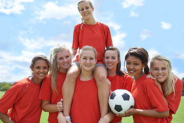 Image showing Women, soccer players and portrait with ball, confidence and football field for match, competition or game. Fitness, practice and happy for training, outdoor and exercise for athlete, girls or sport